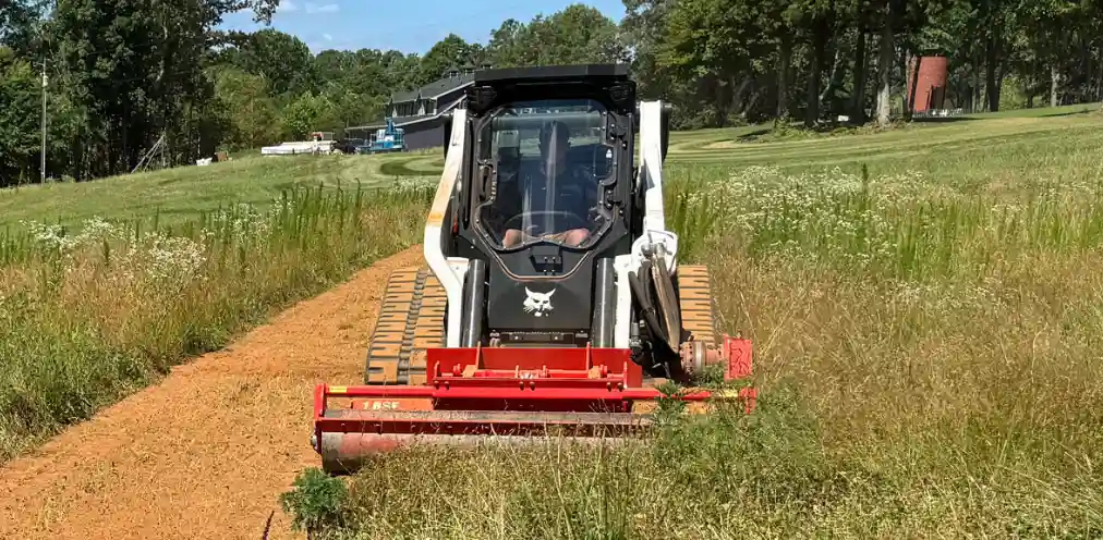 Coneteks Subsoil Mulcher burying plant debris during land clearing
