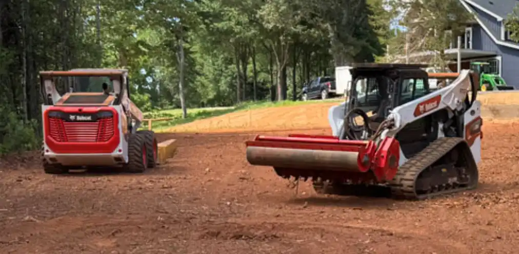 two Bobcats with Coneteks Subsoil Mulchers working on land preparation
