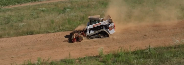 dust cloud from Coneteks Subsoil Mulcher during land clearing
